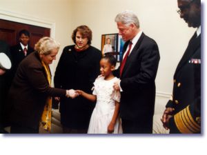 The President, Secretary Albright, and Surgeon General Satcher greet Cynthia and Amy Slemmer at the World AIDS Day Commemoration (12/1/98)