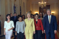 The President and First Lady with teenagers at the conference.