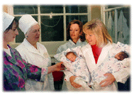 Mrs. Gore Holding Newborns