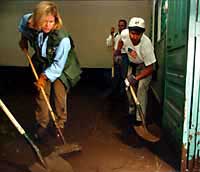 Photo of Tipper Gore participating in clean-up efforts at a school in Honduras