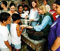 Photo of Tipper Gore preparing a traditional meal at the school in Honduras