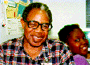 [Photo:  Foster grandparent with child.]