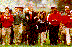 [Photo:  President Clinton marches with AmeriCorps members.]