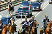 The horse cartege escorts the Presidential motorcade.