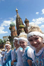 A group of young girls in dance costumes performed outside the Kremlin in Red Square.