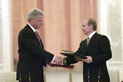 The President shakes hands with President Putin at the conclusion of the signing ceremony.