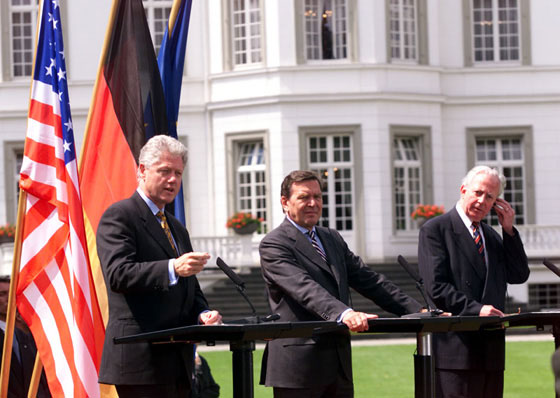 President Clinton, Chancellor Schroeder, and President of the European Union Jacques Santer hold a press conference on the lawn outside of the Palais Schaumburg.
