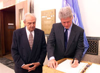 President Clinton signs the guest book after meeting with International Labor Organization leaders.