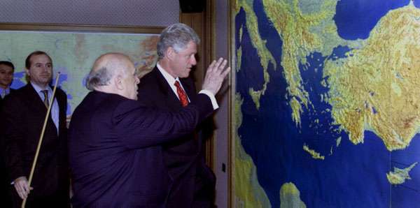 The two presidents look over a world map prior to their bilateral meeting at the Presidential Palace.