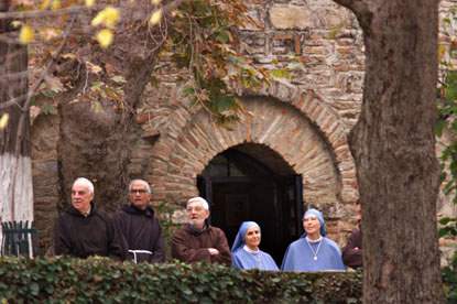 Monks and nuns at Virgin Mary's Grotto in Ephesus, Turkey await a visit by the First Family.