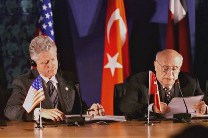 President Clinton seated beside Turkey President Demirel at the signing ceremony.
