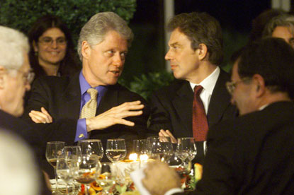 President Clinton talks with British Prime Minister Tony Blair during a dinner at the Villa La Pietra in Florence.