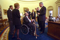 President Clinton and Joe Lockhart greet James Brady, Sarah Brady, and Scott Brady in the Oval Office before the Press Briefing Room dedication ceremony.