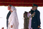 President Clinton and Prime Minister Sheikh Hasina at the official arrival ceremony at Zia International Airport, Bangladesh.