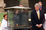President Clinton and Chelsea Clinton observe the eternal flame at the Gandhi memorial, Rajghat Samadhi, New Delhi.