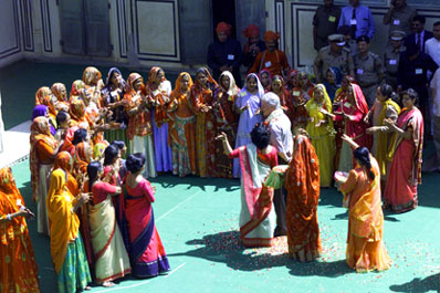 President Clinton is given a traditional greeting by women at the Naila Village outside Jaipur, India.