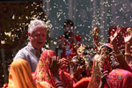 Naila village women shower the President with flower petals as part of a traditional ceremony.