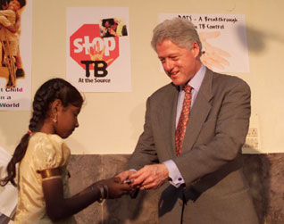 President Clinton administers polio immunization and tb treatment at Mahavir Trust Hospital.