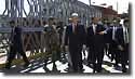 Photo: President Clinton and President Flores walk across the Juan Moolina Bridge, Tegucigalpa, Honduras.