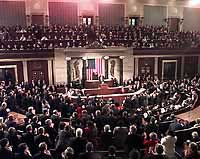 Photograph: Members of Congress rise to applaud during the President's address.