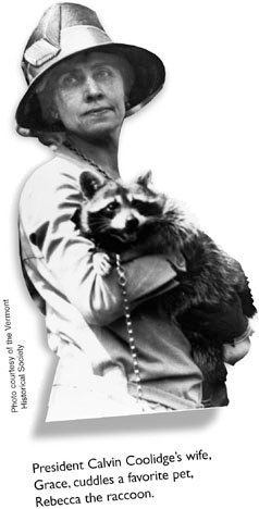 President Calvin Coolidge's wife, Grace, cuddles a favorite pet, Rebecca the racoon.
