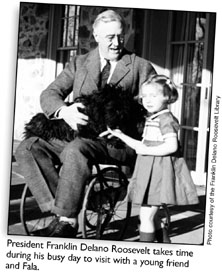 President Franklin Delano Roosevelt takes time during his busy day to visit with a young friend and Fala.